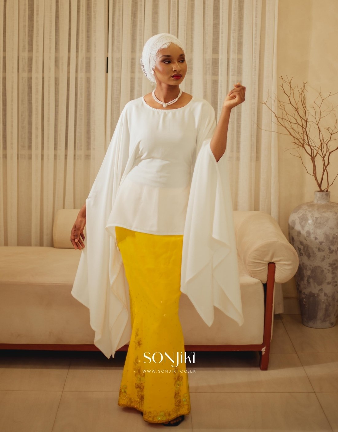 The Maryam Yellow & White Co-ord Set blends hand embellishment with elegant satin. Shop modest luxury co-ords at Sonjiki UK.