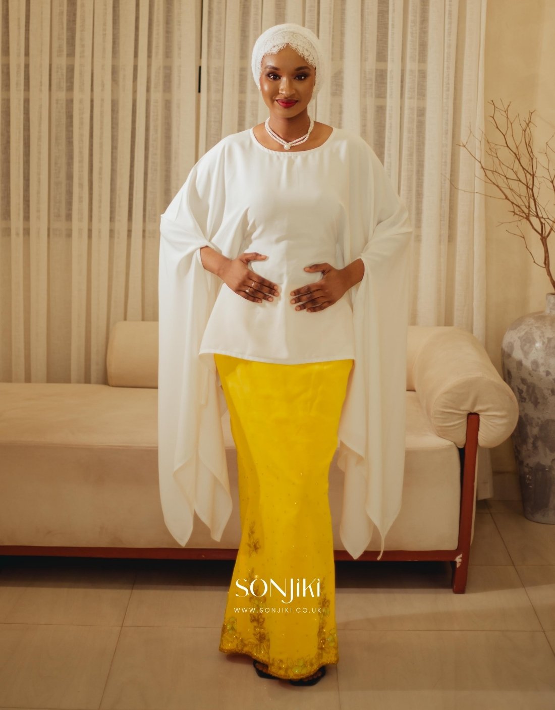 The Maryam Yellow & White Co-ord Set blends hand embellishment with elegant satin. Shop modest luxury co-ords at Sonjiki UK.