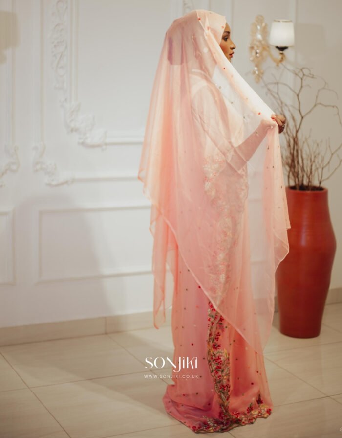 Discover the Safiya Peach Embroidered Chiffon Boubou at Sonjiki. Includes inner dress and veil. Perfect modest African-inspired celebration wear for UK Muslim women.