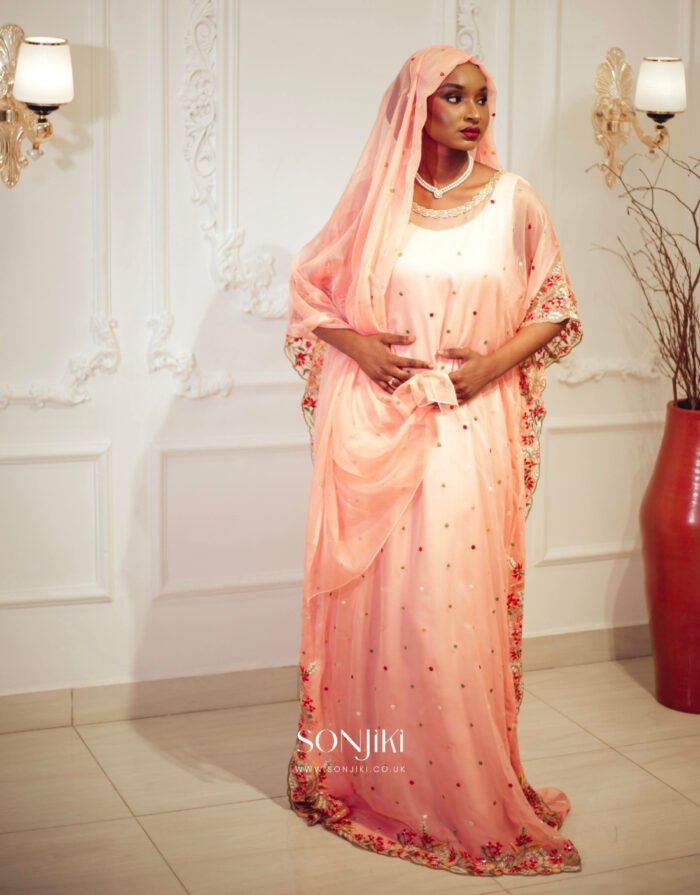 Discover the Safiya Peach Embroidered Chiffon Boubou at Sonjiki. Includes inner dress and veil. Perfect modest African-inspired celebration wear for UK Muslim women.