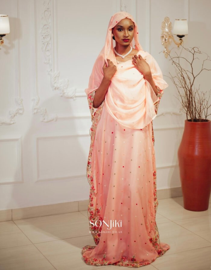 Discover the Safiya Peach Embroidered Chiffon Boubou at Sonjiki. Includes inner dress and veil. Perfect modest African-inspired celebration wear for UK Muslim women.