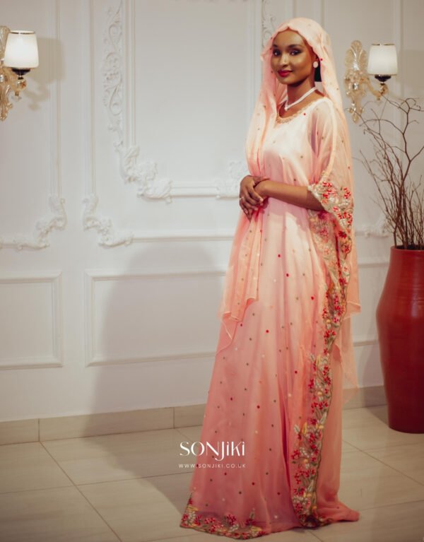 Discover the Safiya Peach Embroidered Chiffon Boubou at Sonjiki. Includes inner dress and veil. Perfect modest African-inspired celebration wear for UK Muslim women.