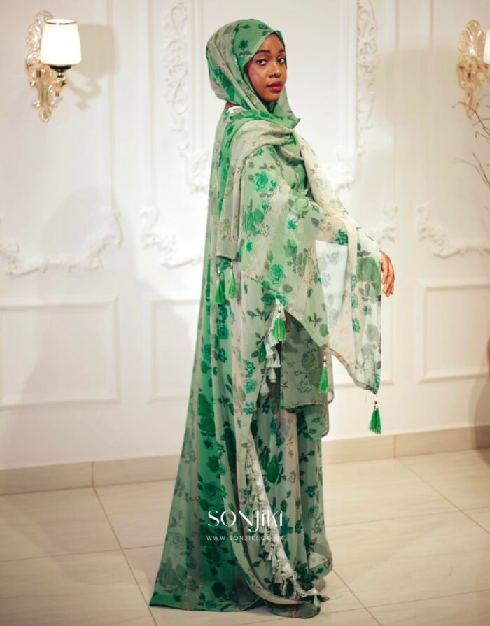 Shop the Hiba Green Floral Boubou at Sonjiki. Features tassel details, inner dress and matching veil. Modest luxury for UK-based cultural celebrations.