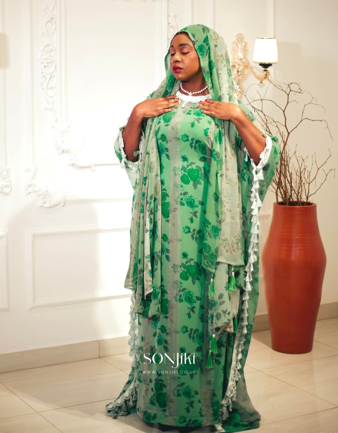 Shop the Hiba Green Floral Boubou at Sonjiki. Features tassel details, inner dress and matching veil. Modest luxury for UK-based cultural celebrations.